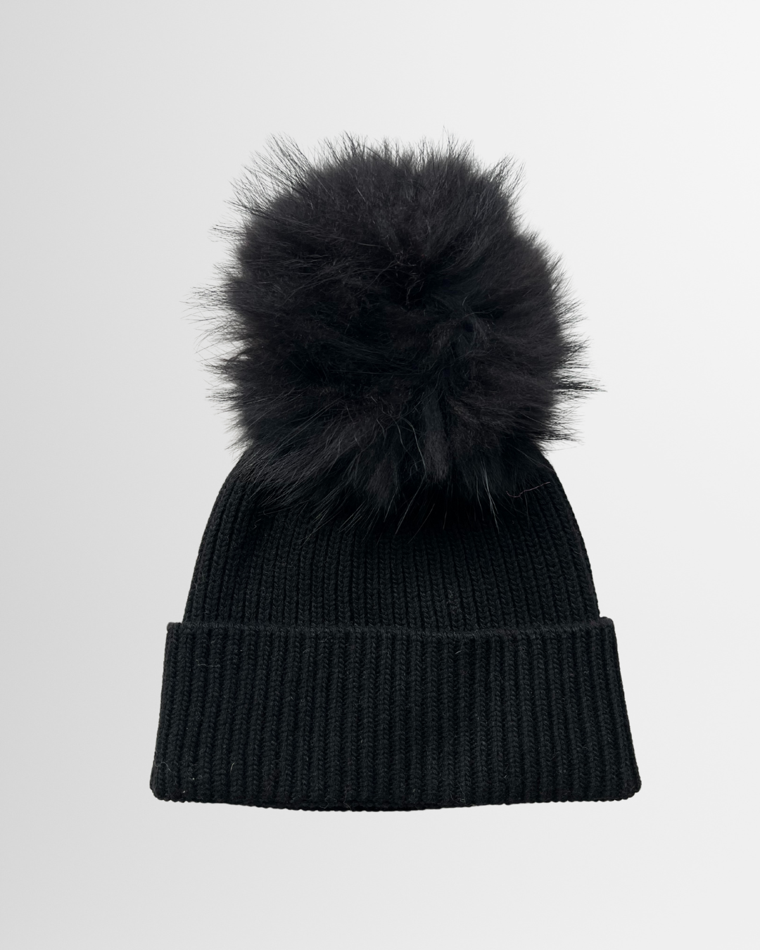 Berretto con pon-pon nero
